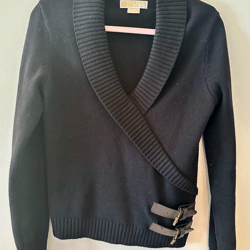 Michael Kors black knit wrap sweater with buckles.
